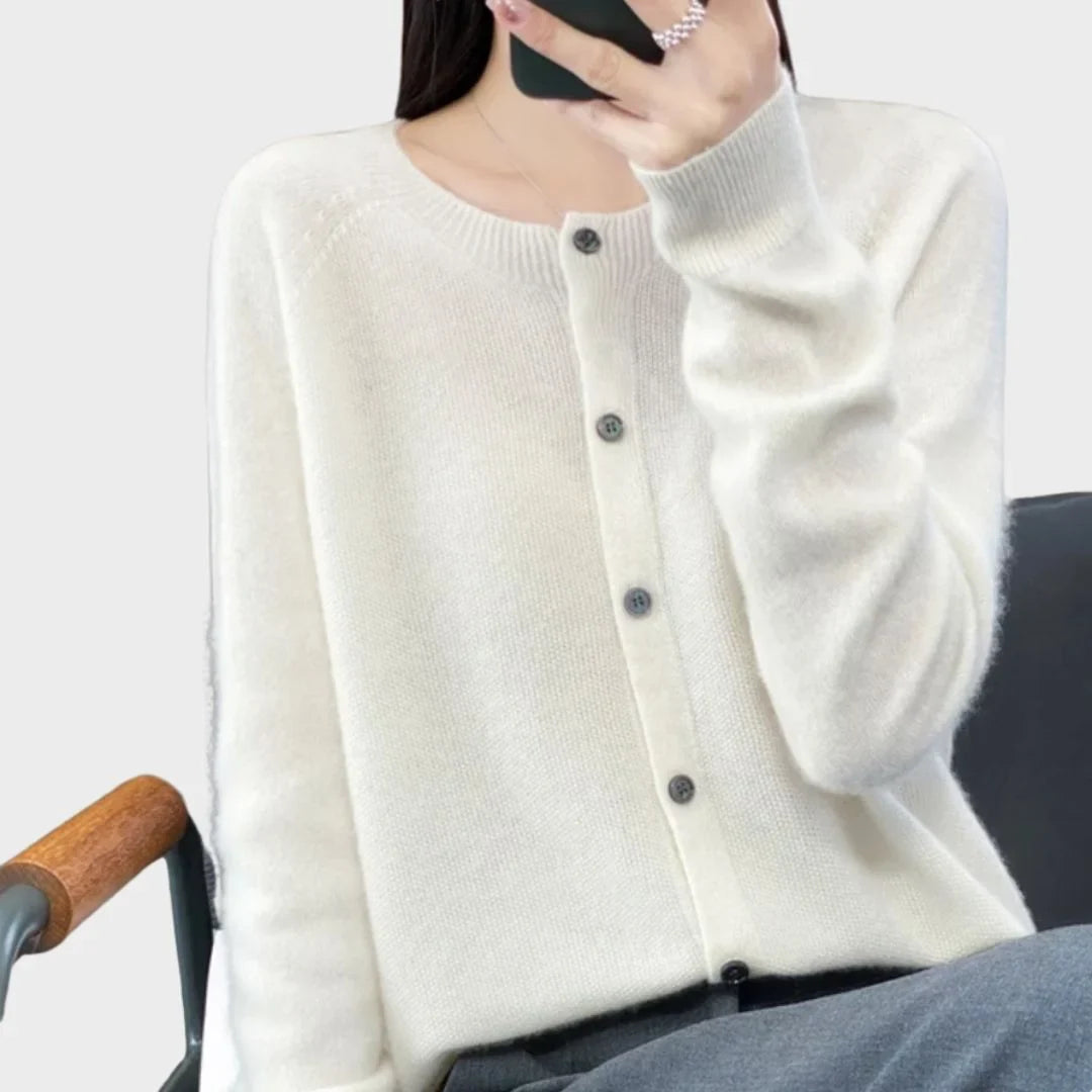 Elegant women's crew-neck cardigan, long-sleeve, styled for a chic look. Versatile layering fashion.