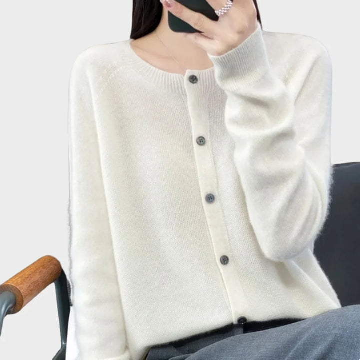 Elegant women's crew-neck cardigan, long-sleeve, styled for a chic look. Versatile layering fashion.