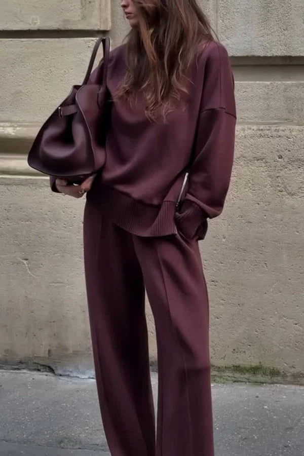 Women's knit matching set: soft turtleneck top & wide-leg trousers for cozy fall/winter loungewear.
