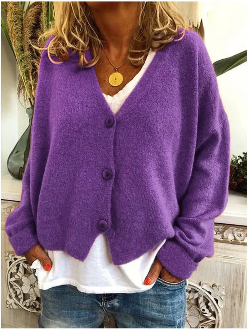 Plus size women's oversized V-neck cardigan sweater, long sleeve, button front. Cozy & comfortable winter fashion.