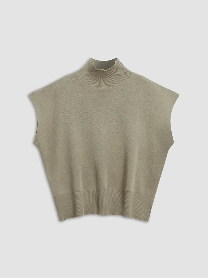 Sophisticated women's top: mock neck, padded cap sleeves, structured knitwear for versatile fashion.