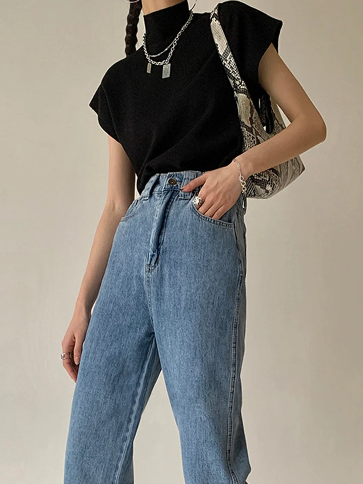 Women's versatile mock neck top, elegant padded cap sleeves, knit for sophisticated fashion.
