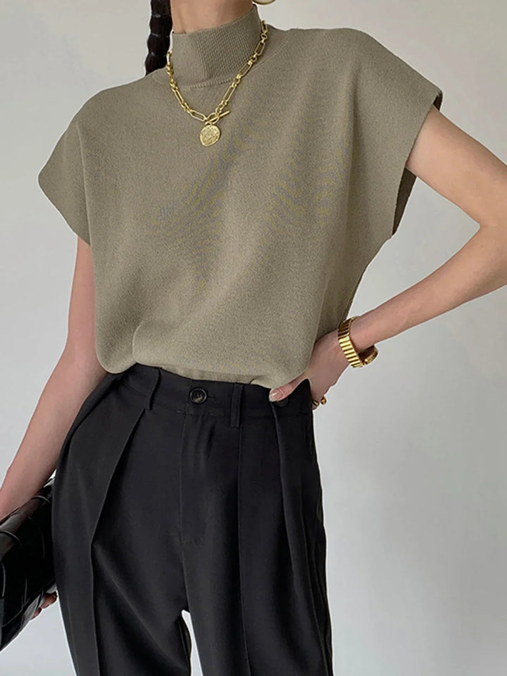 Smart casual women's mock neck knit, padded shoulders & cap sleeves for a chic, modern style.