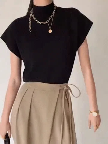 Elegant women's mock neck top with cap sleeves & padded shoulders, a sophisticated knit for women.