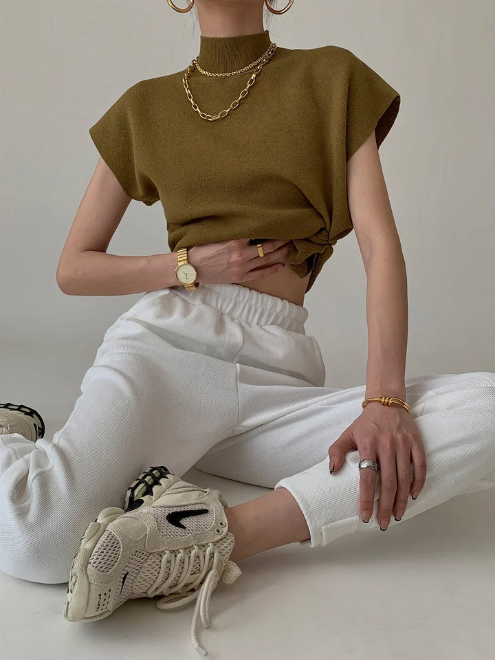 Women's elegant knit, mock neck, padded cap sleeves, perfect for adding structure to outfits.
