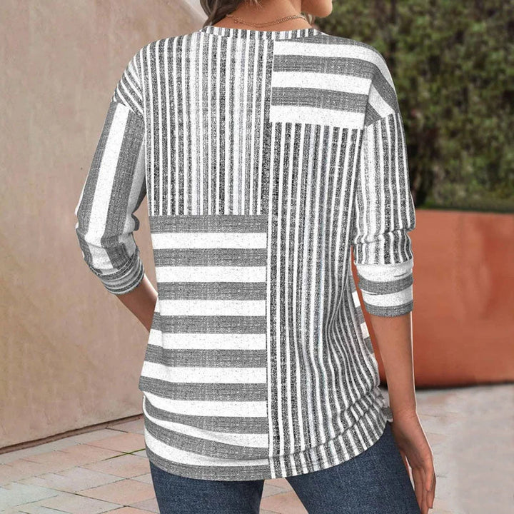 Chic women's patchwork striped blouse featuring 3/4 sleeves & a crew neck. Versatile top for casual or everyday wear.