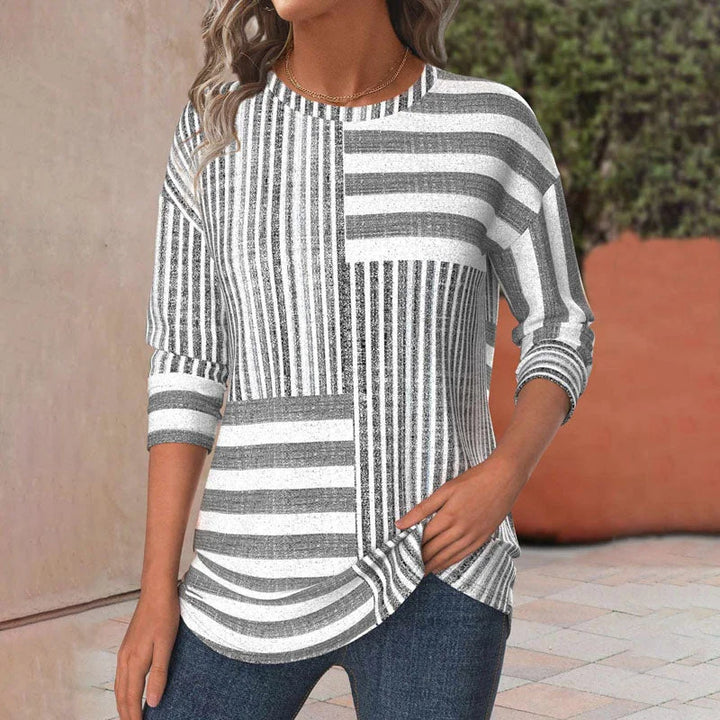 Women's casual patchwork striped blouse with 3/4 sleeves & crew neck. Comfortable, loose-fit everyday fashion top.