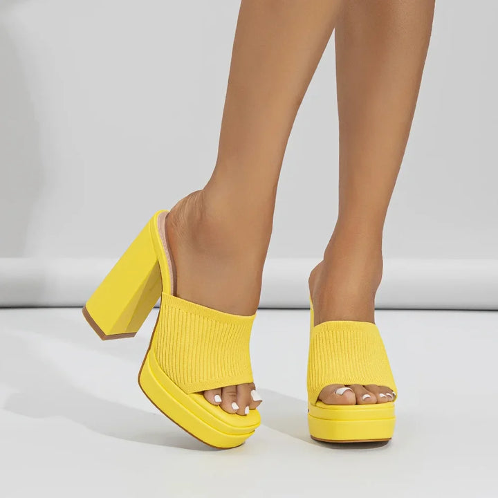 Women's open-toe platform sandals with a chunky heel, offering style and comfort.