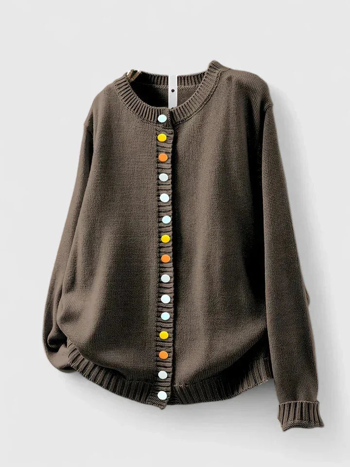 Front view of a women's relaxed fit button-front cardigan sweater, showcasing its multi-color buttons.