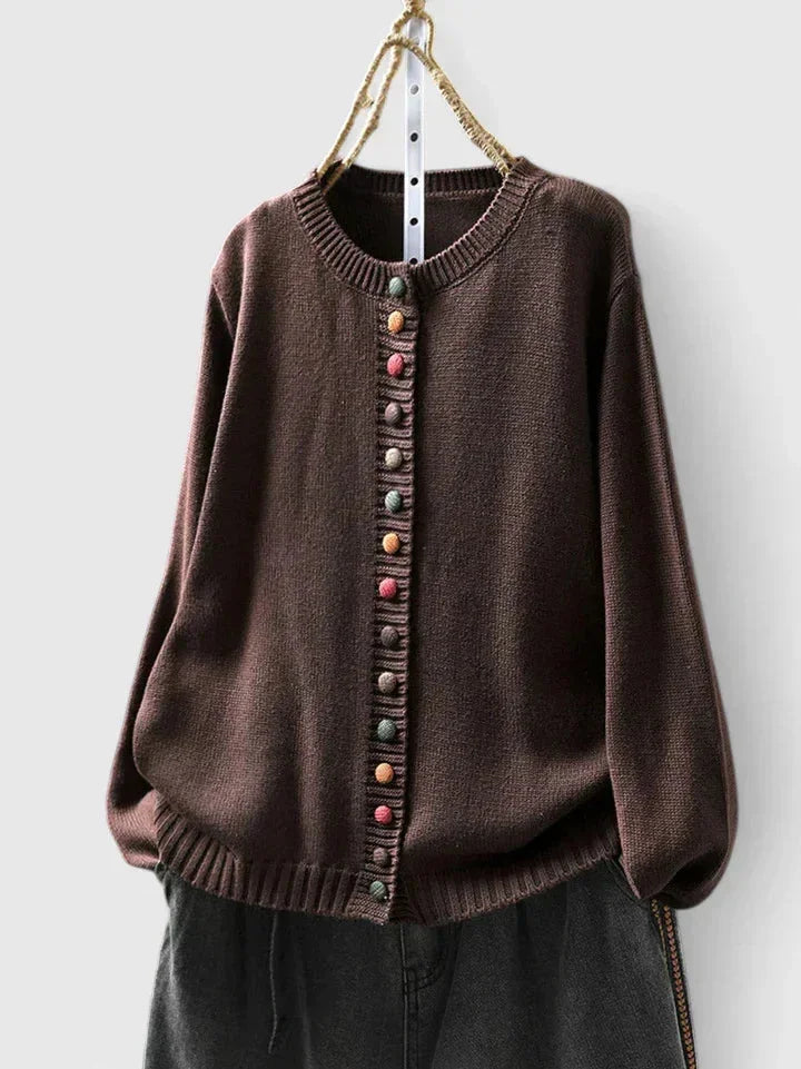 Stylish women's button-front cardigan sweater with unique multi-color buttons & cozy relaxed fit.