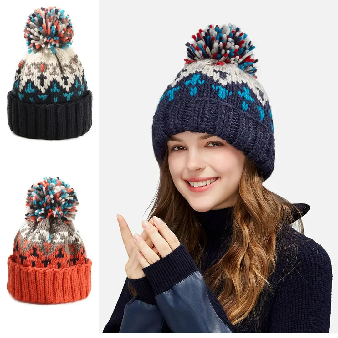 Elegant women's snowflake beanie, complete with a fluffy pom-pom and a secure ribbed cuff for ultimate winter comfort.