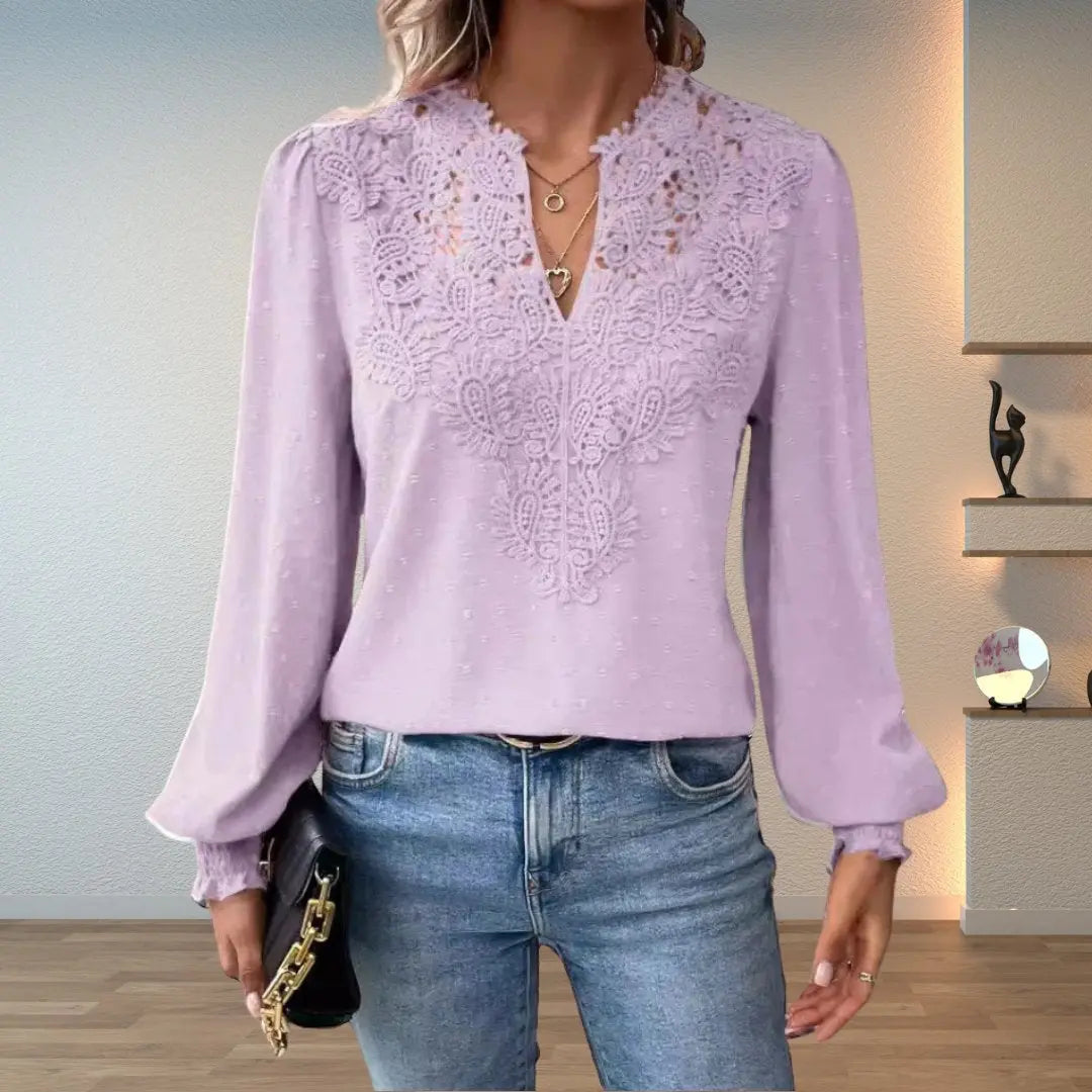 Comfortable women's long sleeve blouse featuring a stylish V-neck and delicate lace accents for an elegant look.