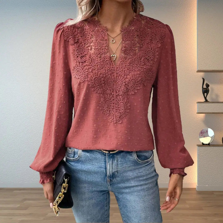 Women's elegant V-neck lace detail blouse with long smocked sleeves, a chic and versatile fashion top.