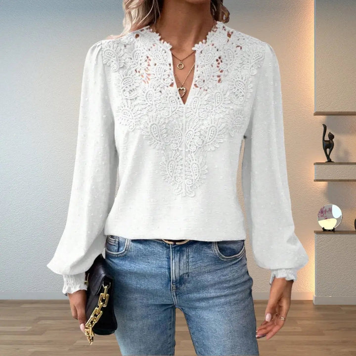 Stylish women's lace blouse, a long sleeve V-neck top with romantic smocked details, perfect for any occasion.