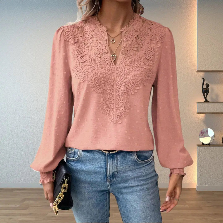 Elegant women's long sleeve V-neck top featuring delicate lace and smocked details for a refined, vintage-inspired look.