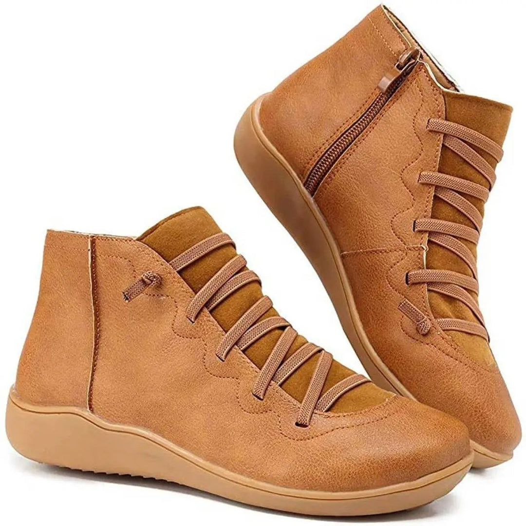 Women's chic black lace-up flat ankle boots with side zip. Perfect for casual everyday wear.