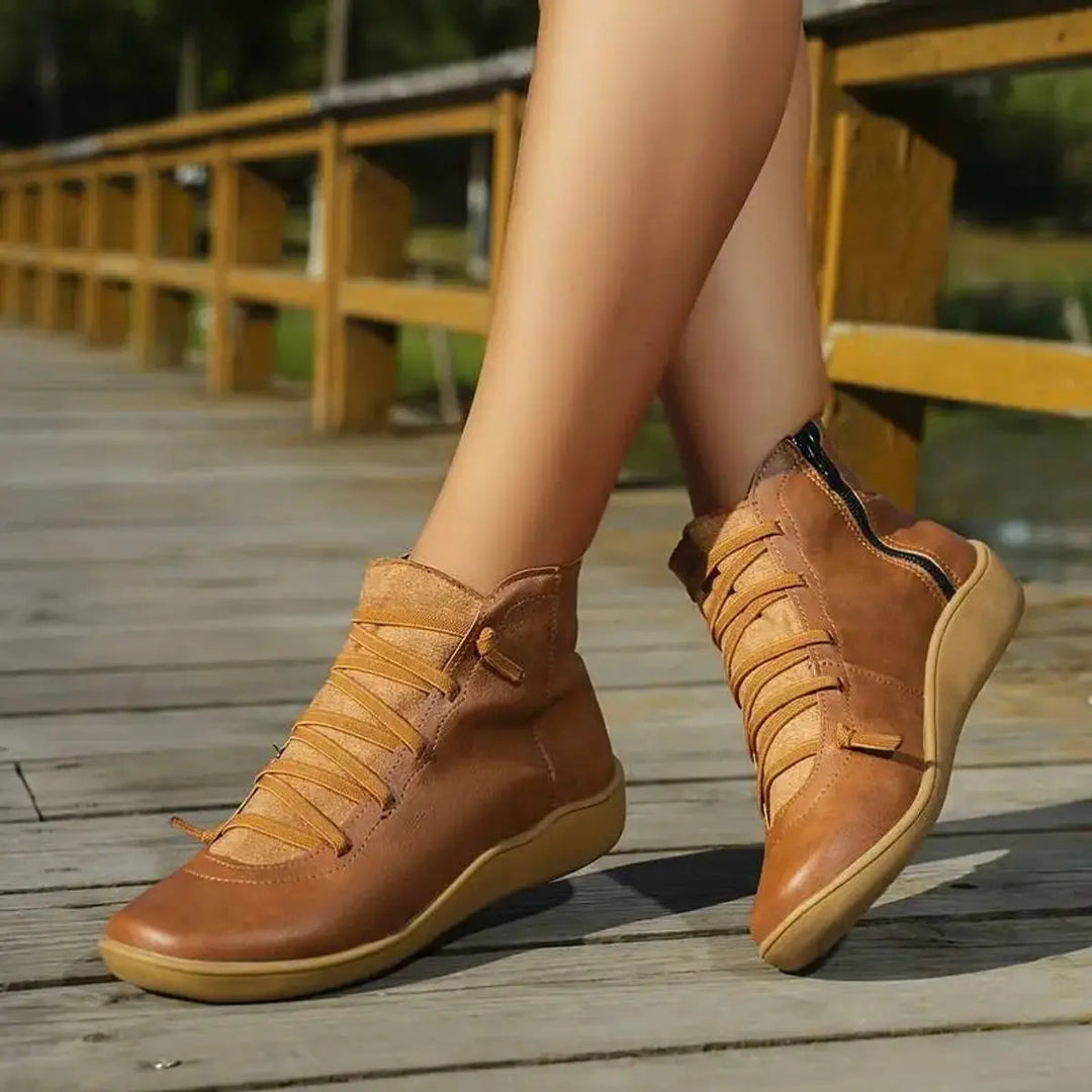Women's casual lace-up flat ankle boots, suitable for everyday style. Features a convenient side zip.
