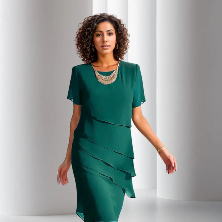 Stylish layered tiered midi cocktail dress for women, featuring an elegant design & short sleeves. Perfect for parties.