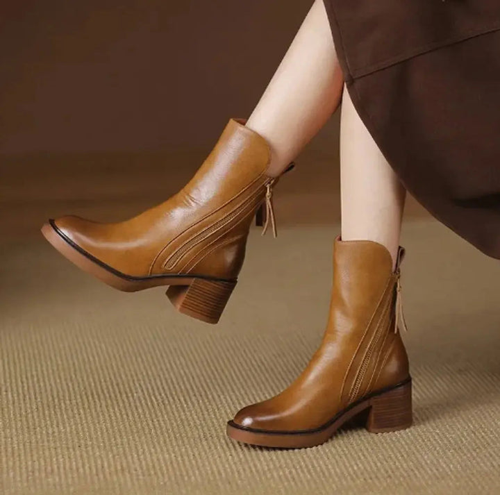 Chic women's leather ankle boots with block heel & convenient side zip. Perfect for autumn smart casual style.