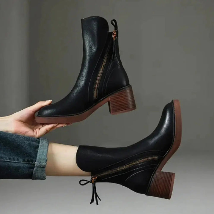 Women's sleek leather ankle boots with sturdy block heel & functional side zip. Smart & comfortable autumn footwear.