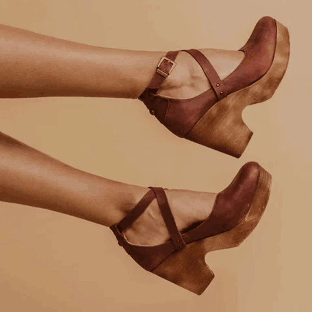 Chic women's closed-toe Mary-Jane wedge heels, perfect for formal or casual outfits, with a supportive ankle strap.