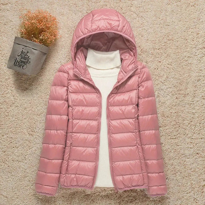 Cozy & lightweight women's hooded quilted puffer jacket, perfect for autumn fashion, travel, and warmth.