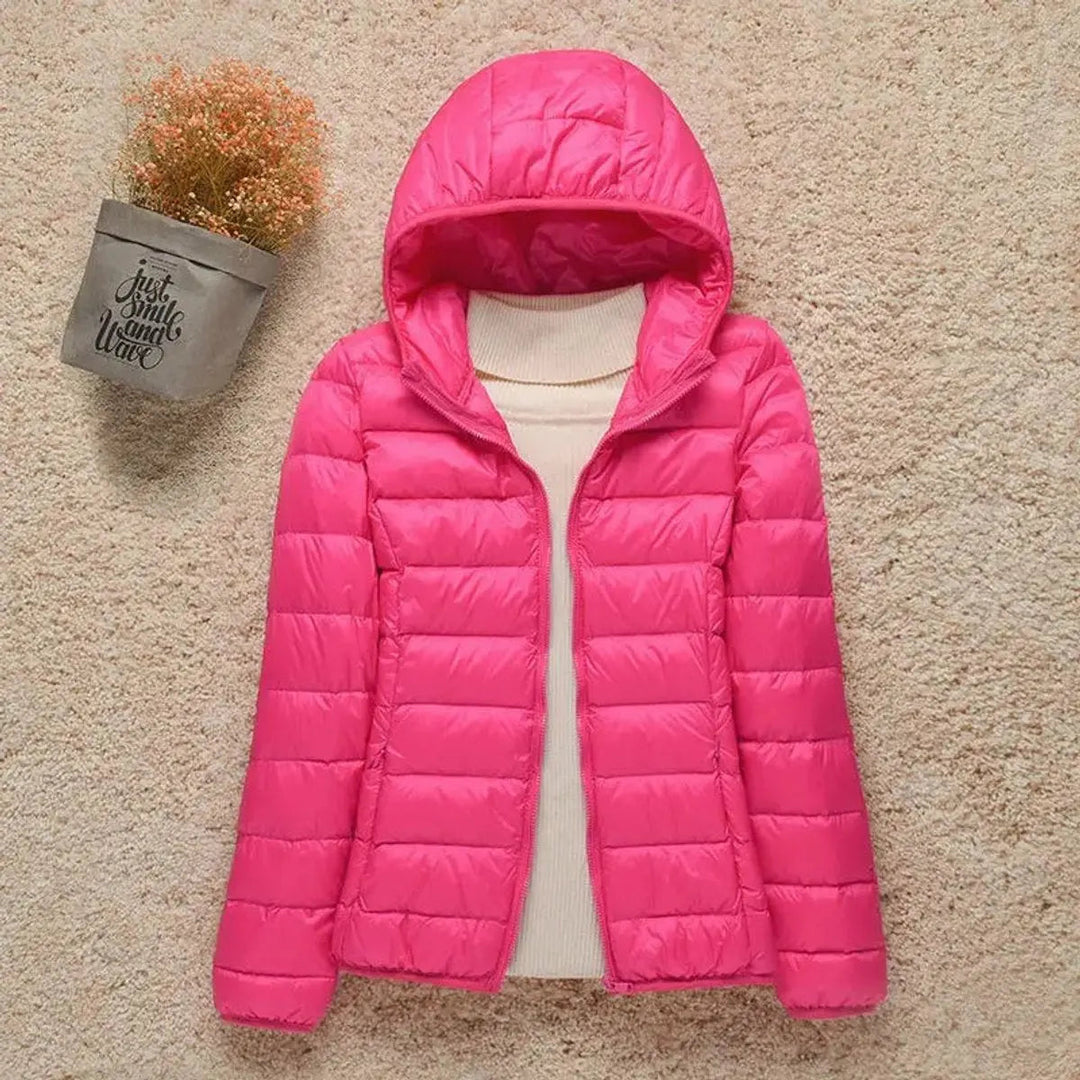 Women's lightweight quilted hooded puffer jacket, packable for versatile outdoor & everyday casual wear.