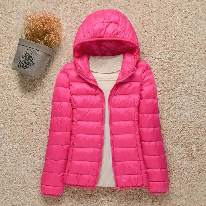 Women's lightweight quilted hooded puffer jacket, packable for versatile outdoor & everyday casual wear.