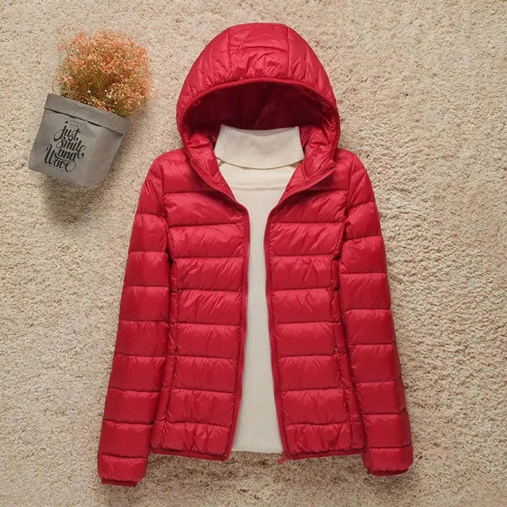 Packable women's hooded quilted puffer jacket, lightweight and perfect for travel, hiking, and daily wear.