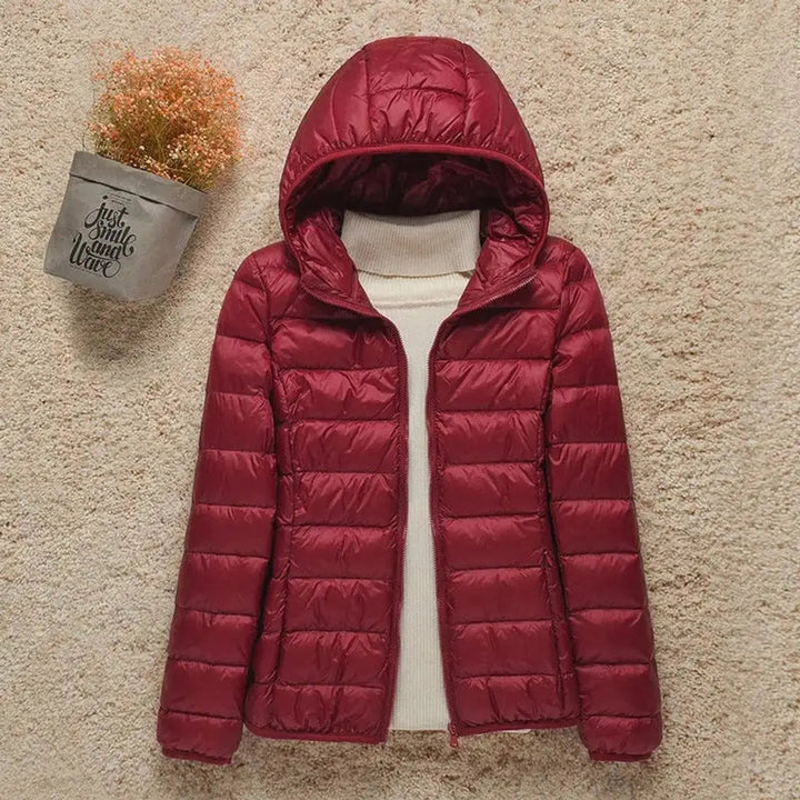 Women's hooded quilted puffer jacket, lightweight for autumn fashion, winter warmth & outdoor style.