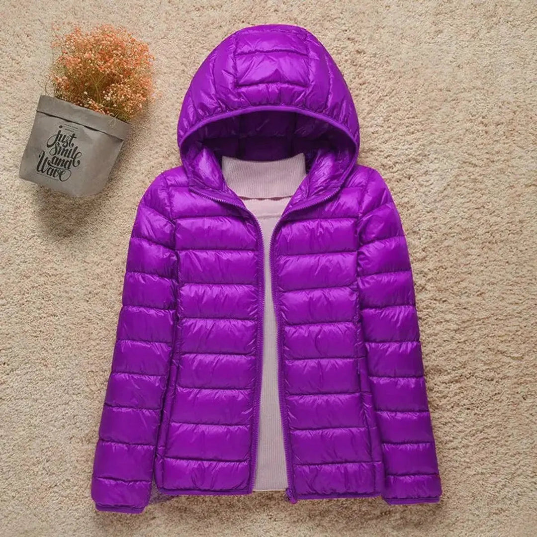 Casual women's lightweight hooded quilted puffer jacket, offering cozy warmth & modern style for daily use.
