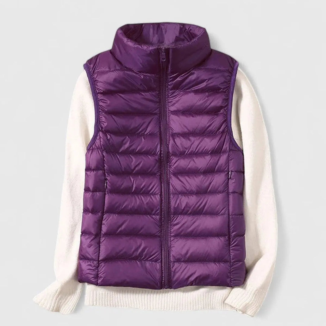 Back view of a women's quilted gilet, showcasing its elegant silhouette and comfortable, versatile fit.