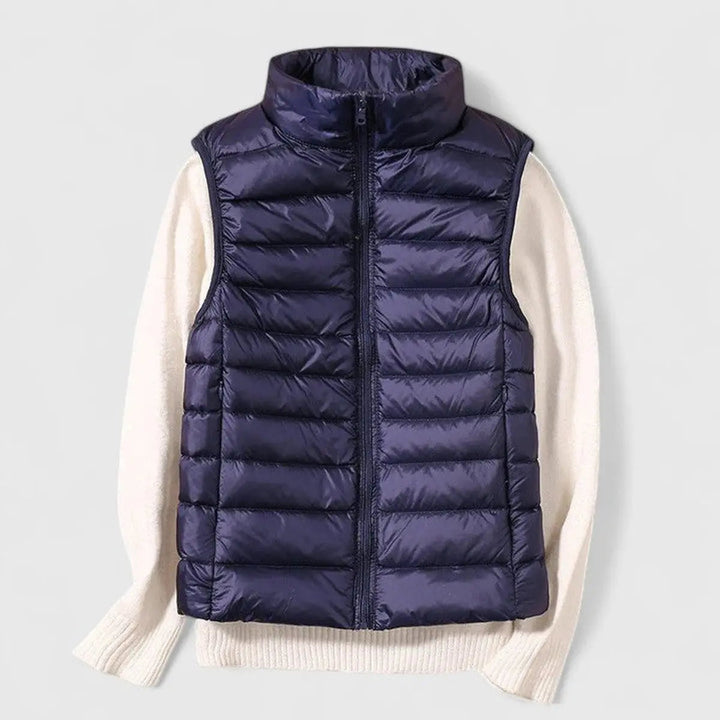 Women's lightweight quilted vest, displayed flat, emphasizing its design & practical, everyday appeal.