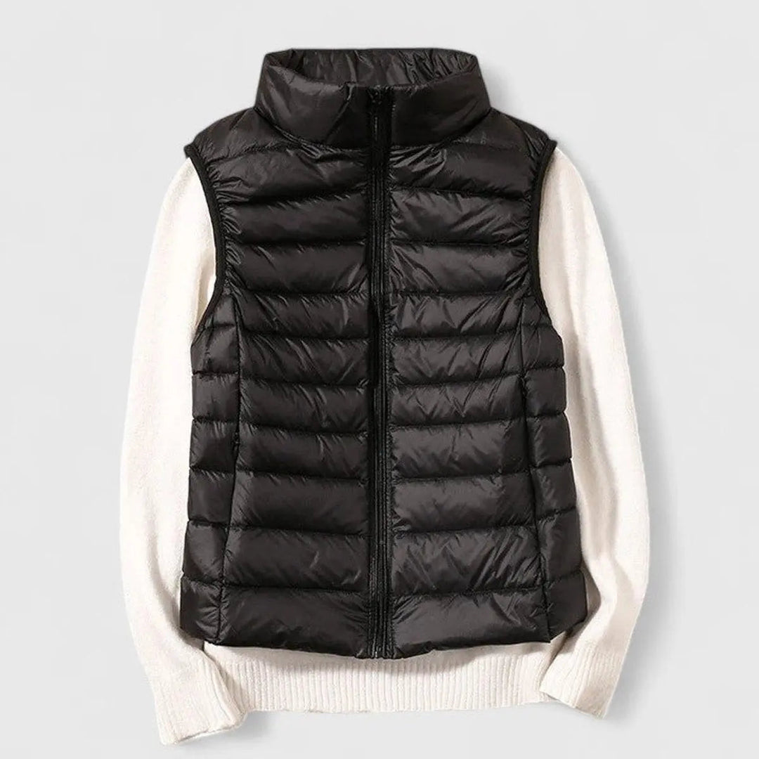 Versatile ladies' puffer gilet in an outdoor setting, perfect for cool weather & transitional fashion.