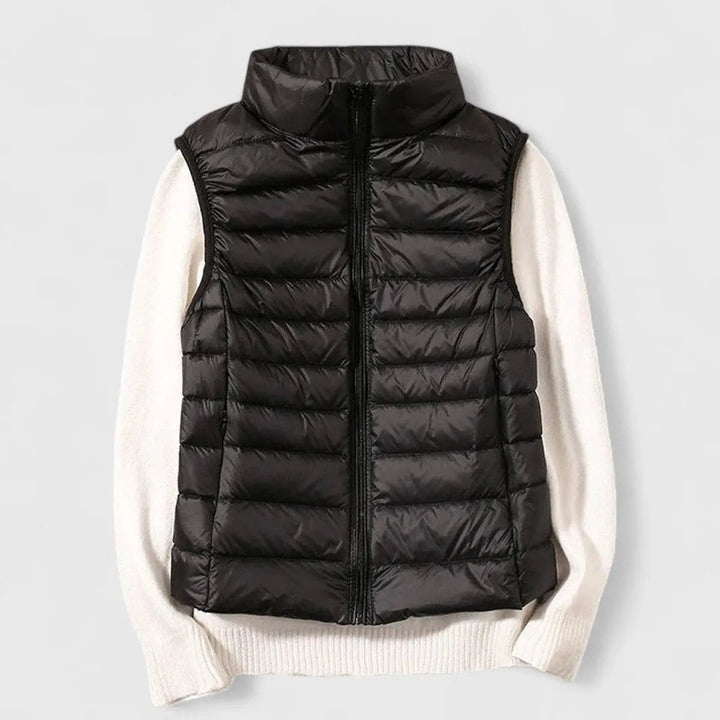 Versatile ladies' puffer gilet in an outdoor setting, perfect for cool weather & transitional fashion.