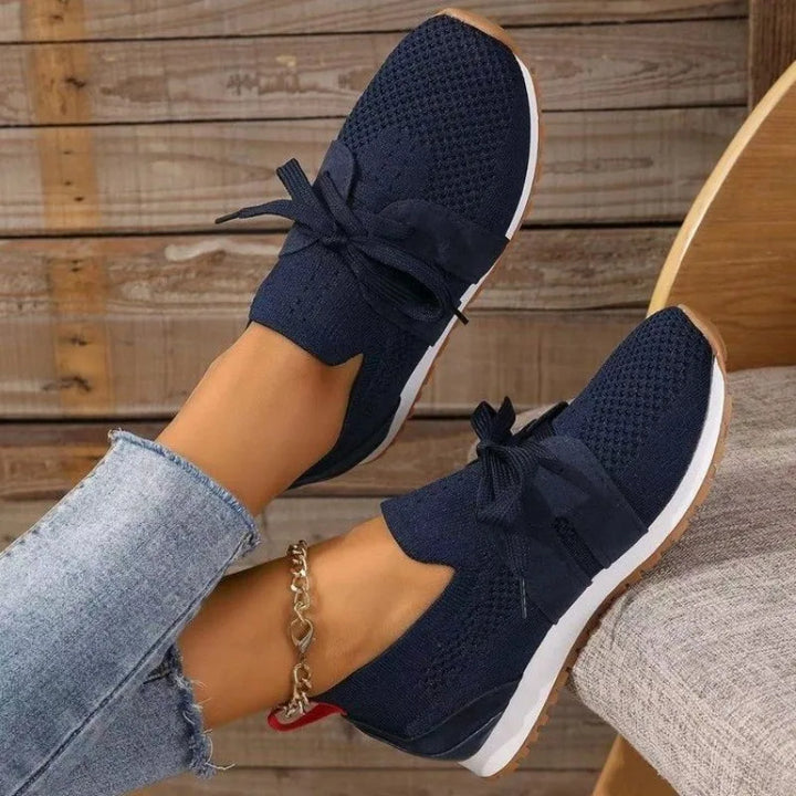 "Women's lightweight walking sneakers with breathable mesh upper, soft cushioning, and supportive natural flex sole"