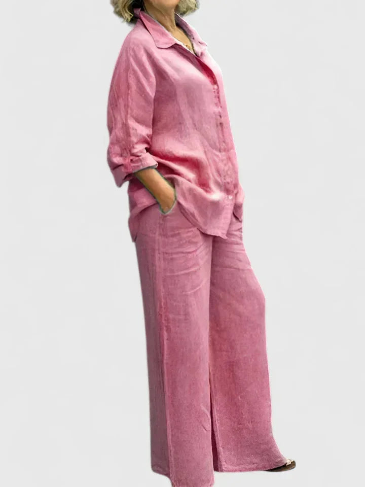 Women's relaxed two-piece set featuring a button-down shirt and wide leg pants, perfect for casual spring/summer.