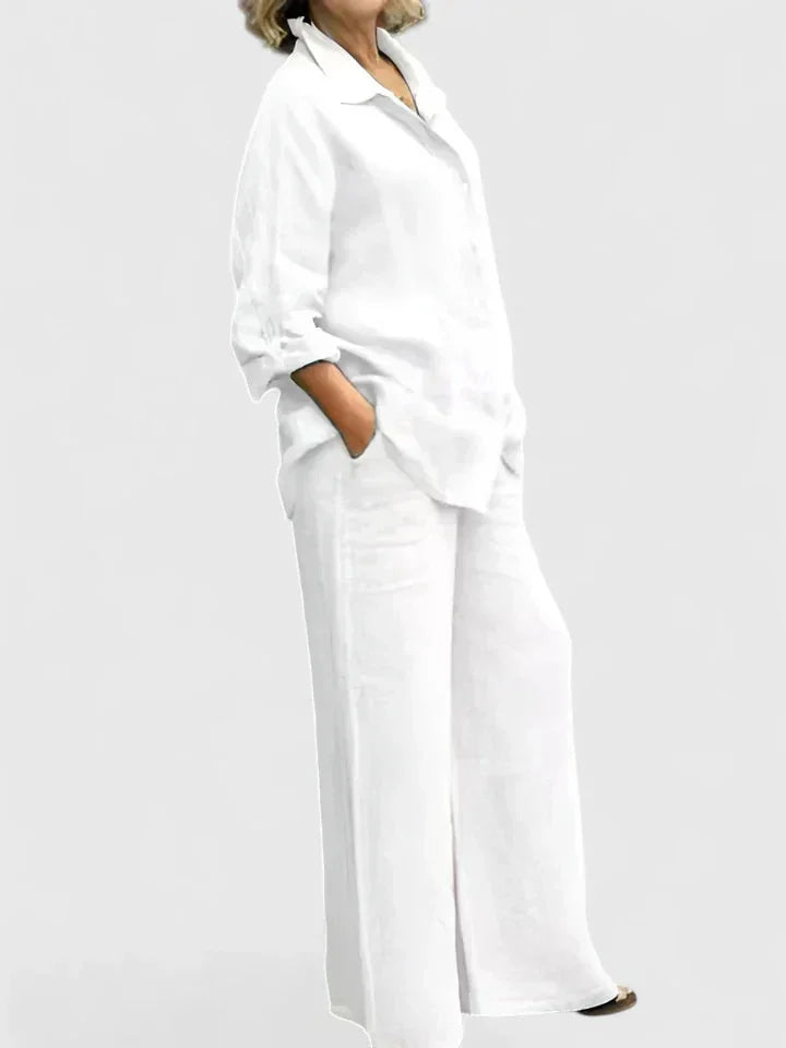 Breathable women's button-down shirt and wide leg pants set, offering a relaxed and stylish summer look.
