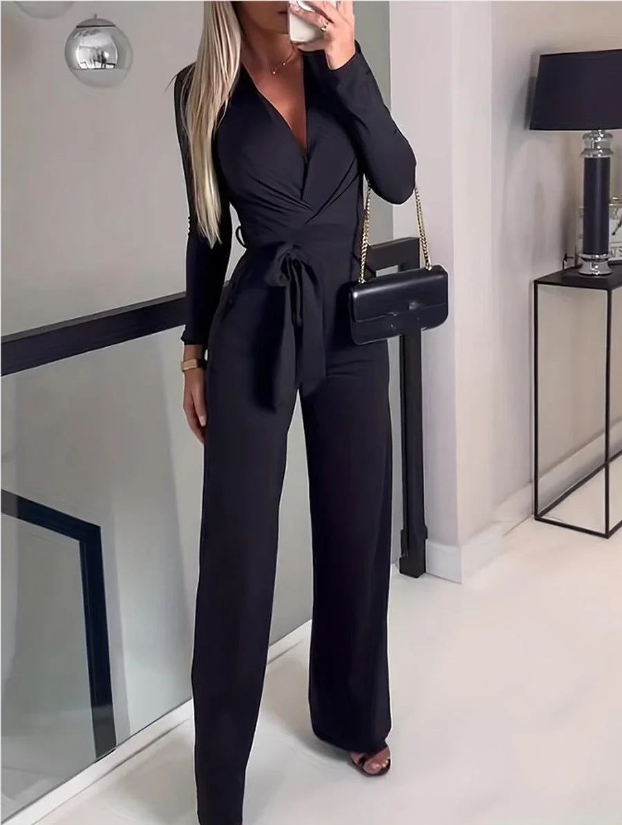 Chic women's V-neck wide-leg jumpsuit, featuring long sleeves & a flattering tie-waist. Versatile one-piece style.