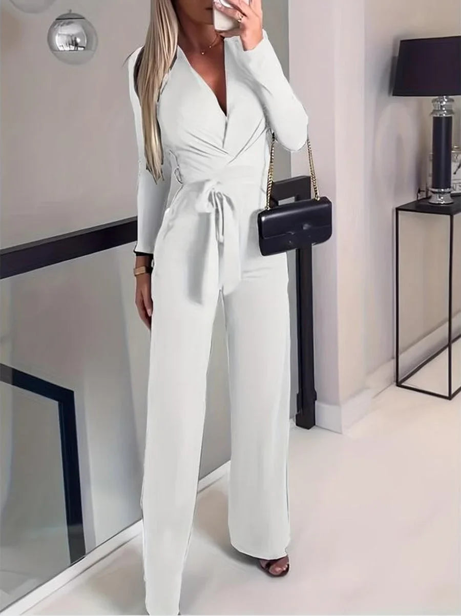 Comfortable women's long-sleeve V-neck wide-leg jumpsuit. Features a fashionable tie-waist for a flattering fit.