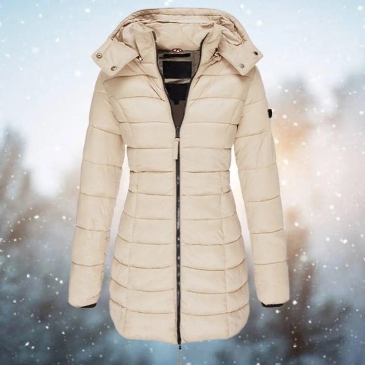 Elegant women's longline puffer coat, a fashionable hooded quilted outerwear for winter.