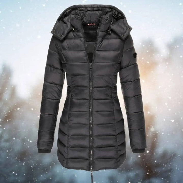 Zip-front women's longline hooded quilted puffer jacket, offering ultimate winter warmth.