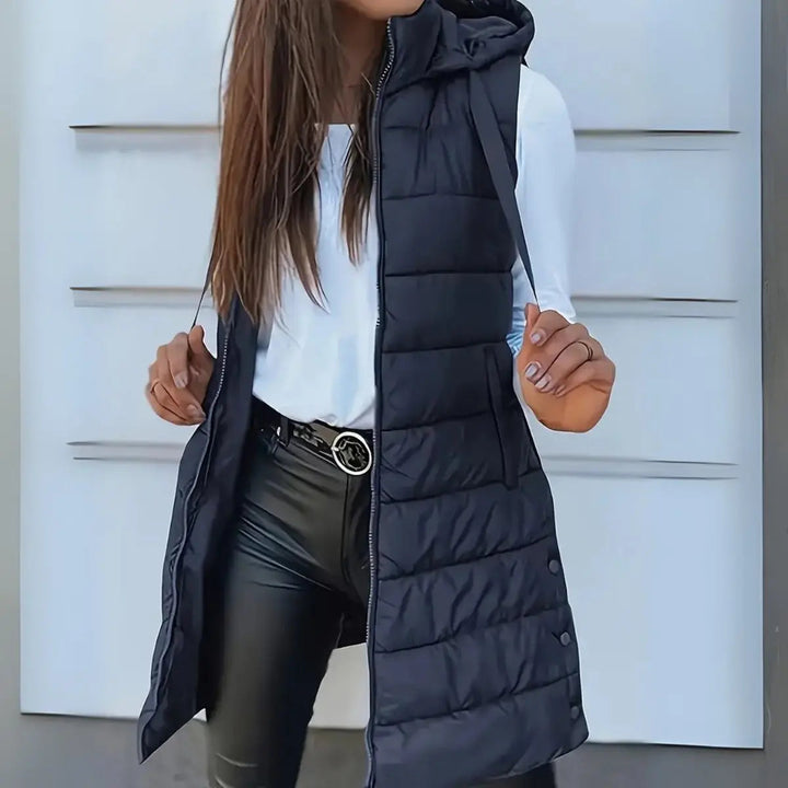 Chic women's longline puffer vest, a fall essential & winter fashion layering piece for warmth.