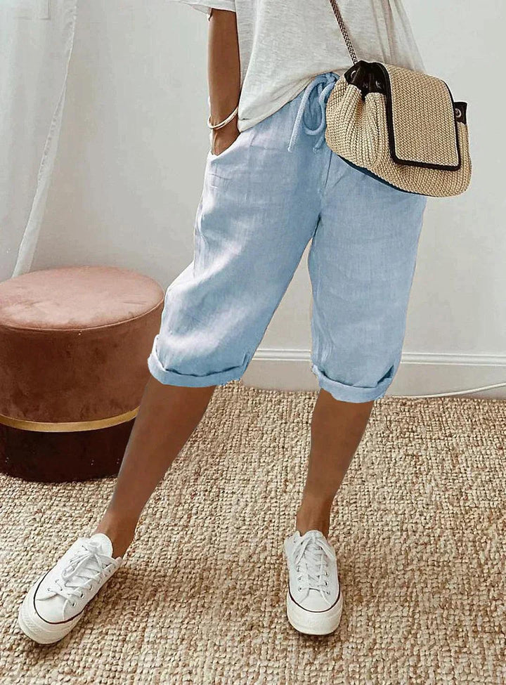 Women's loose-fit linen capri pants, front view showcasing breezy, relaxed design for casual summer style and comfort.
