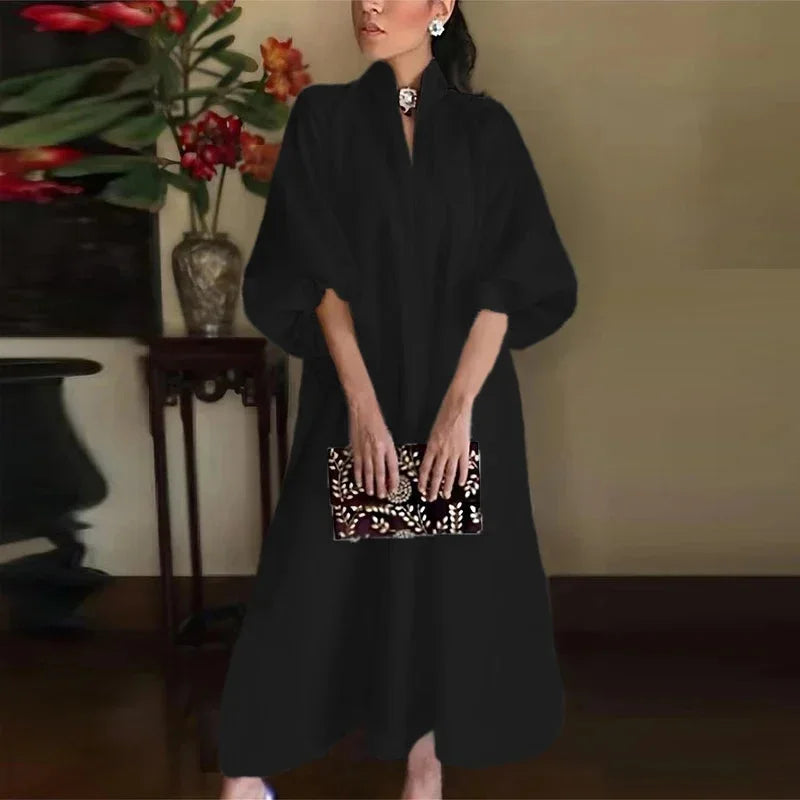 Women's black high-neck sleeveless maxi dress with a relaxed fit, ideal for elegant evening wear or comfortable summer casual.
