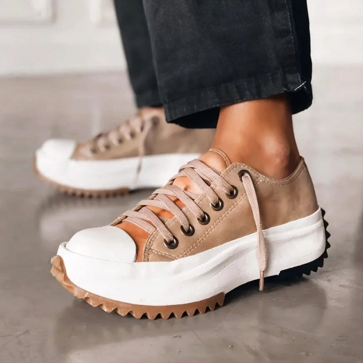 Stylish women's low-top platform sneakers. Chunky sole, lace-up closure for active, comfortable walking.