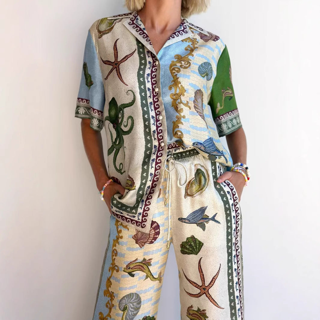 Women's marine print linen blend set with a relaxed shirt and wide-leg pants, ideal for casual or beach occasions.