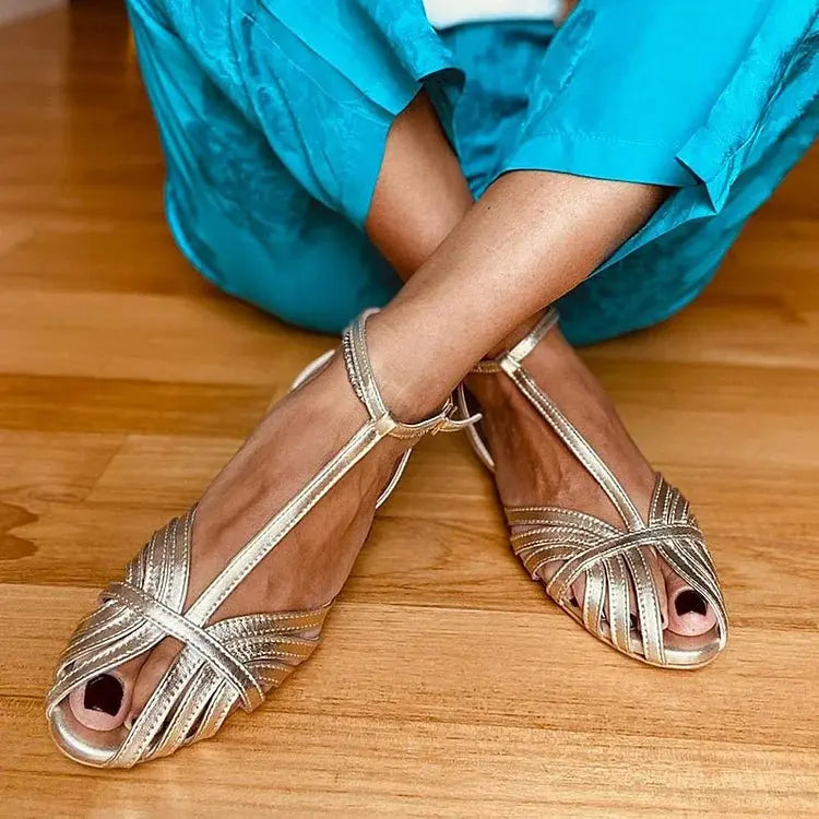 Elegant women's gray metallic T-strap sandals with a peep toe, perfect for glamorous evening parties & summer comfort.