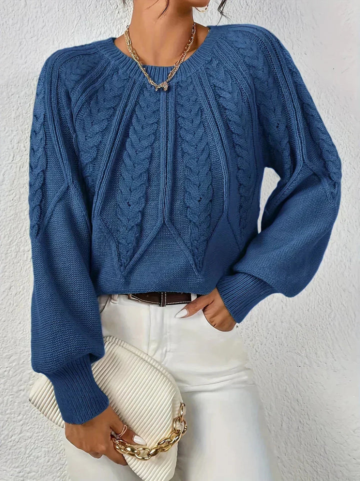 Comfortable women's cable knit crew neck sweater, casual long-sleeve knitwear for winter comfort.
