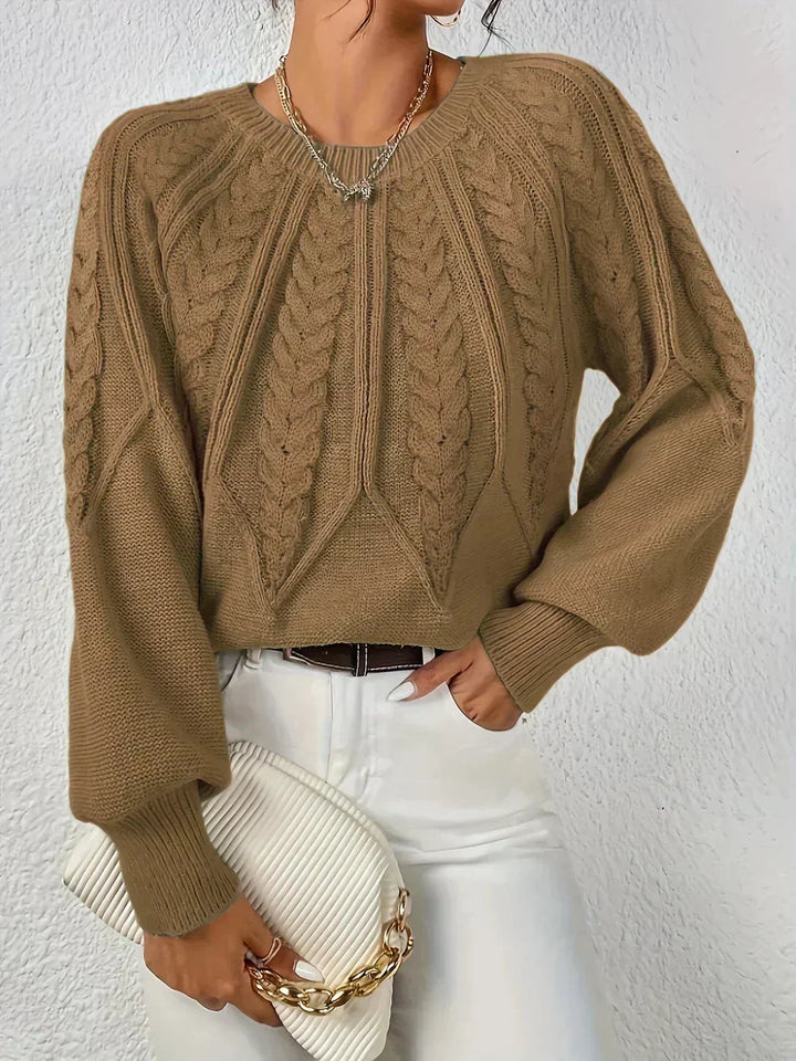 Trendy women's cable knit crew neck sweater with voluminous sleeves. Cozy fall & winter style.